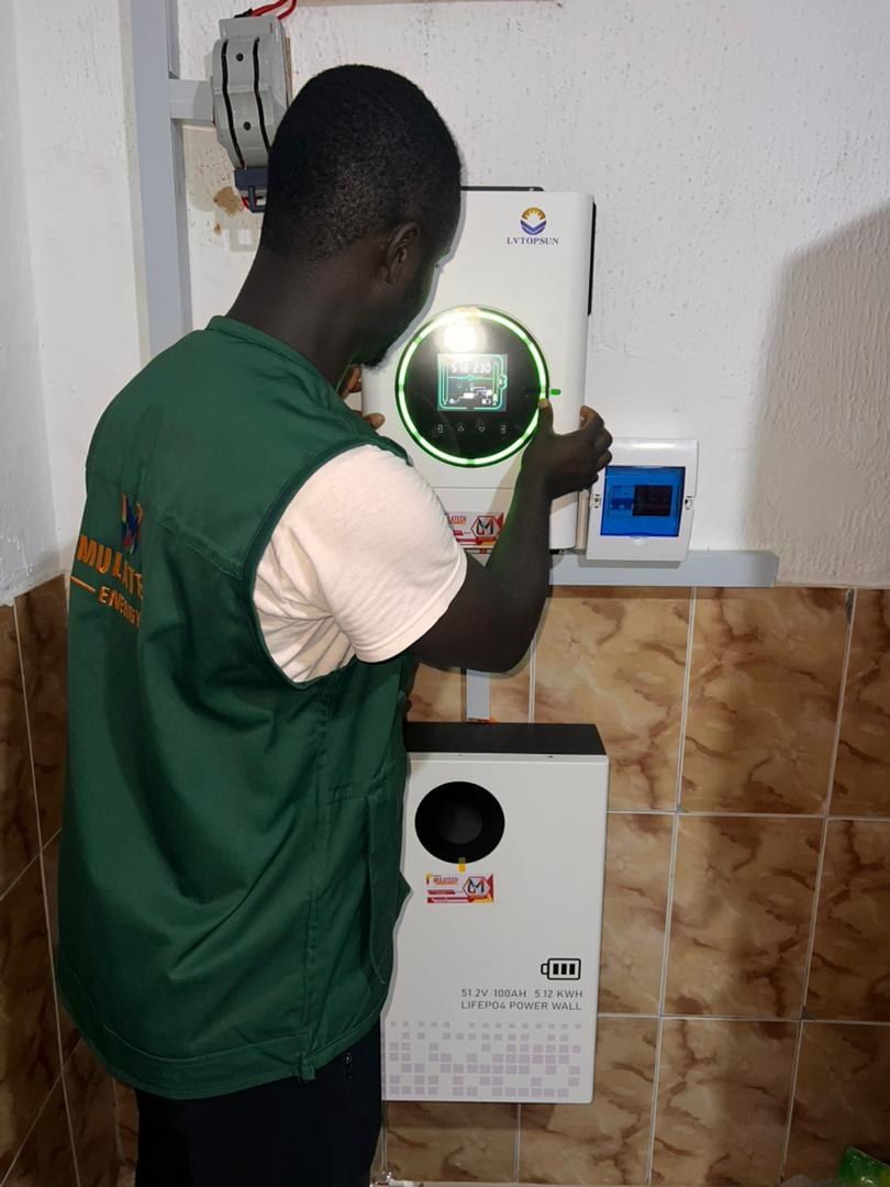 Mulatech technician commissioning a hybrid system, Nigeria